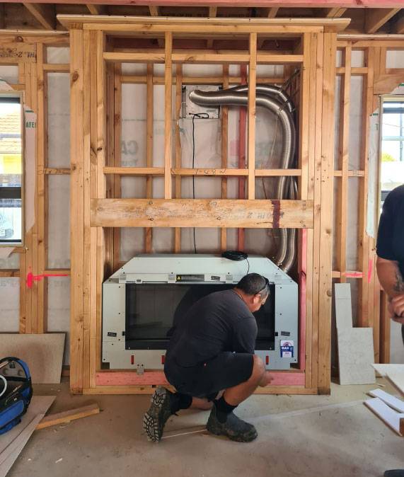 Worker installing heating system